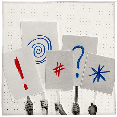 people’s hands holding signs with punctuation marks on them