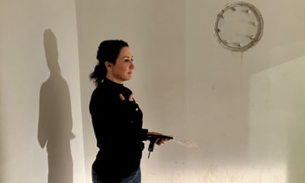 Yamit Malul Yanai standing in front of a white wall