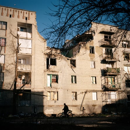 A block of flats with bomb damaged that has left a large hole in the top two floors