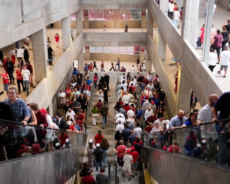 a group of people file up into venue