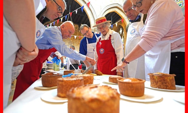 An array of pies are judged during the Annual British Pie awards at St Mary's church in Melton Mowbray, Leicestershire.