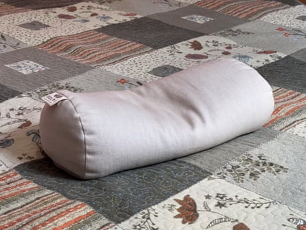 A Sachi Organics Buckwheat Neck Pillow with some of the filling removed