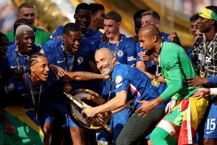 Enzo Maresca celebrates with the Club World Cup trophy after Chelsea’s victory in the final over PSG.