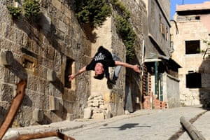 Syrian youths practise parkour in Aleppo, northern Syria