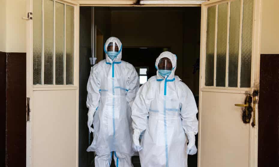 Staff in full safety gear outside a new isolation unit at the Connaught hospital in Freetown. 