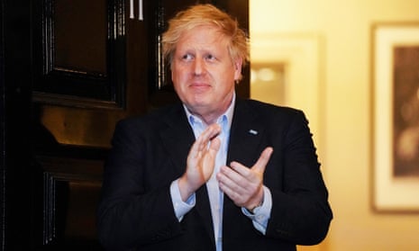 Boris Johnson applauding the nation's carers outside 11 Downing Street.