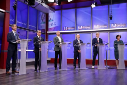Six group opinionated by podiums successful a tv studio.