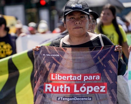 A woman holds a placard asking for the release of Ruth Lopez.