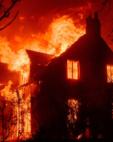 A house consumed by flames.