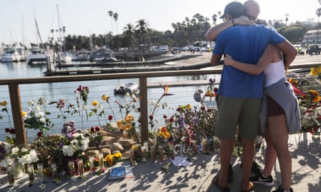 People embrace at a makeshift memorial for victims of the Conception boat fire on 3 September 2019 in Santa Barbara, California. 