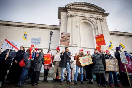 Staff outside Tate Britain in London on Thursday.