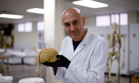 Prof Jim Al-Khalili with a model of the human brain.