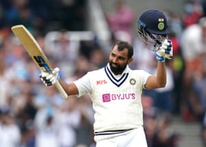Mohammed Shami celebrates hitting a half century.
