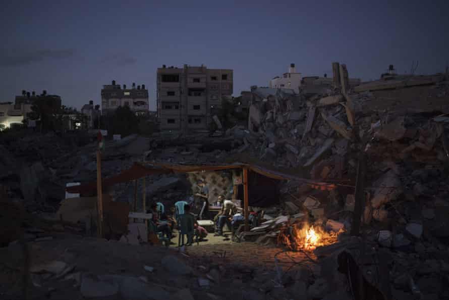Agency photographer of the year – 2021 shortlist | World news 3 A family sits inside a makeshift tent built among the rubble of their home, destroyed by an airstrike in Beit Lahiya, northern Gaza Strip, 14 June 2021.