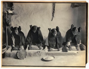 Four young Hopi women grind grain in Arizona, around 1906