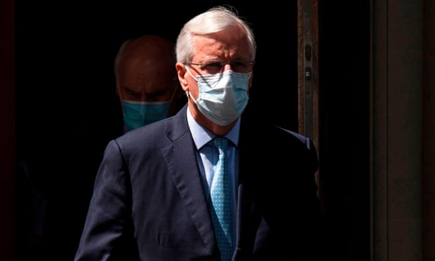 Michel Barnier wears a face mask as he leaves Europe House, headquarters of the EU delegation, in London
