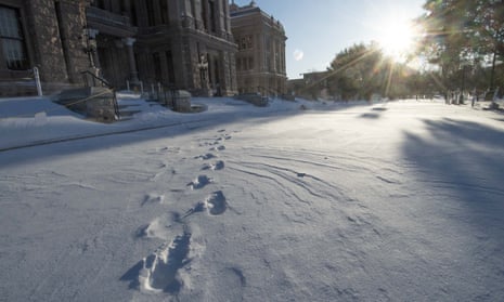 The south steps of the Texas capitol in Austin are covered in snow on 15 February. 