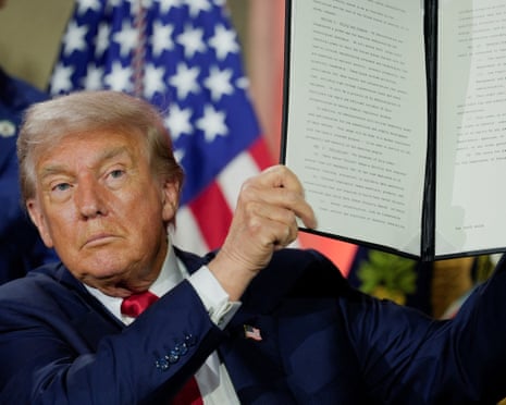 Man holds up executive order