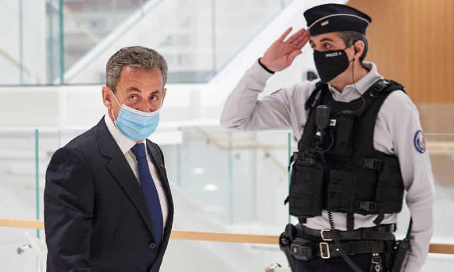 The former French president Nicolas Sarkozy leaves court in Paris after being found guilty on Monday of corruption and influence-peddling.