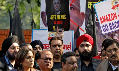 Members of the Confederation of All India Traders protesting against Jeff Bezos’s visit in Delhi. Signs read: 'Jeff Bezos go back!' and 'Amazon – go back'