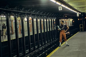 a Willy Spiller photo titled "Ghettoblaster Man Waiting, 72nd St. Station West Side IRT Line, 1977-1985": a man standing on the very edge of an empty subway platform holding a large boombox