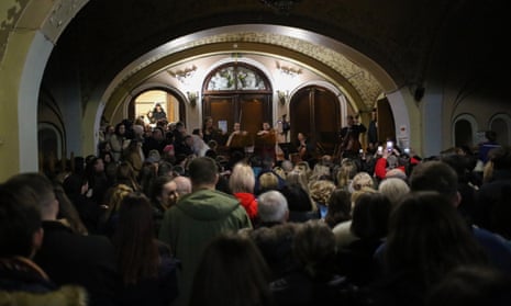 Spectators watching a concert in the lobby of the Odesa Regional Philharmonic due to an air raid signal on New Year’s Eve