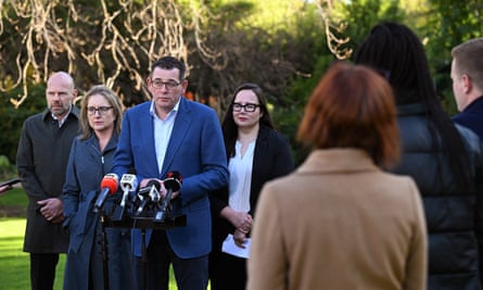 The Victoria premier, Daniel Andrews (third left), speaks to the media during a press conference at Parliament House in Melbourne.