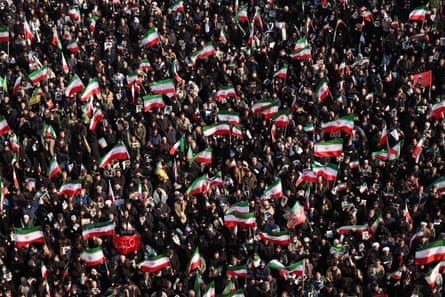 Overhead view of Iranians gathered in the square waving flags