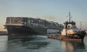 The Ever Given cargo ship being is pulled through the Suez Canal after being freed late last month.
