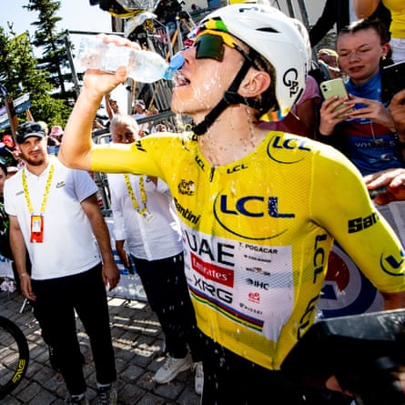 Tadej Pogacar drinks h2o arsenic he celebrates aft crossing nan decorativeness statement to triumph shape 19.
