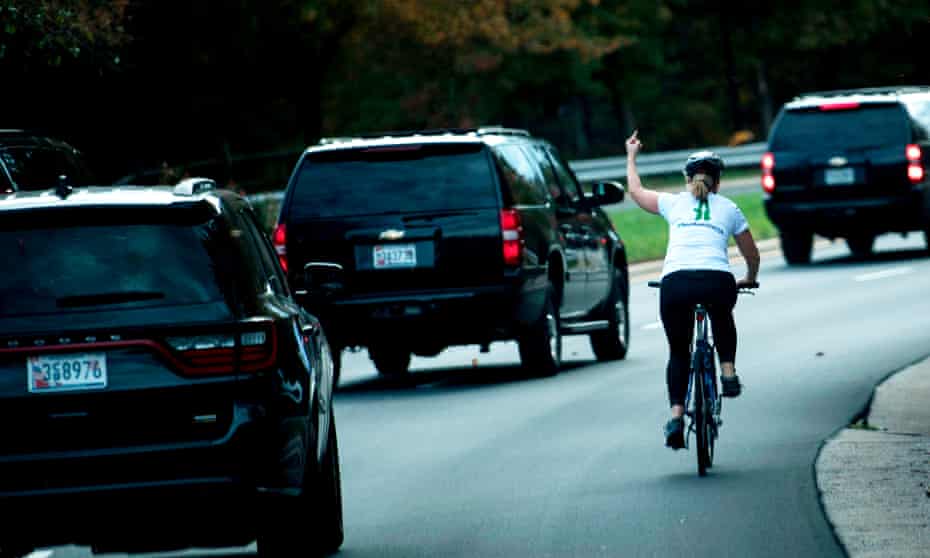 The woman repeated her gesture once she had caught up with the motorcade.