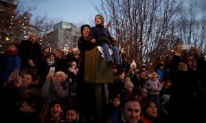 Families watch the parade in Madrid