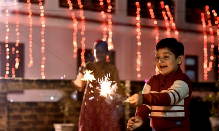 A child enjoys the festival of lights in Jammu.