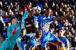 Shrewsbury Town’s Omar Beckles is denied by West Ham United’s Angelo Ogbonna and Joe Hart, left, in the goalless draw at New Meadow