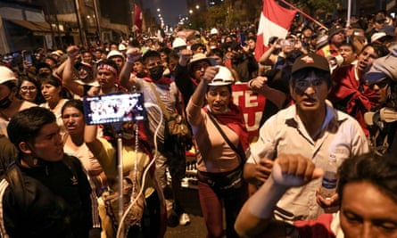 People gather to protest against the government in Lima on Friday.