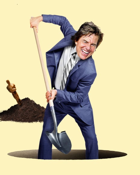 Tom Cruise digs a hole with a shovel beside a pile of dirt containing a buried Oscar statuette