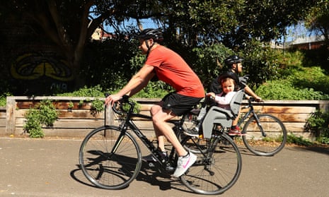 man and baby riding a bike