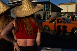 Yeah the girlsLate afternoon on Tuff Street, two girls watch the steady procession of classic cars at Summernats 34. After being cancelled in 2021 due to Covid-19, the infamous Canberra car festival returned in January 2022, albeit with a reduced-capacity crowd. Canberra,