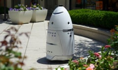 White cone-shaped robot outdoors