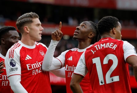 Eberechi Eze celebrates by pointing to the sky.
