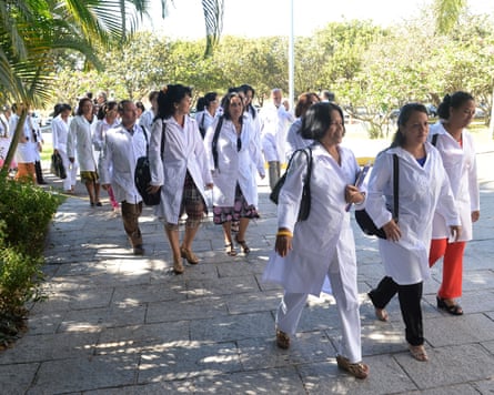 Foreign physicians – mainly Cuban – arrive at the University of Brasilia for a meeting with Brazilian health minister Alexandre Padilha, in Brasilia on August, 2013.