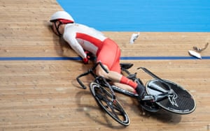 Joe Truman of Team England crashes during the men’s track cycling keirin at the Commonwealth Games in London, UK