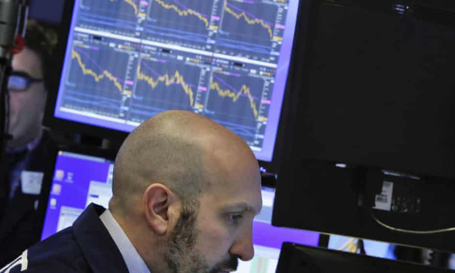 Specialist James Denaro works on the floor of the New York stock exchange on Friday as stocks wavered between small gains and losses in morning trading.