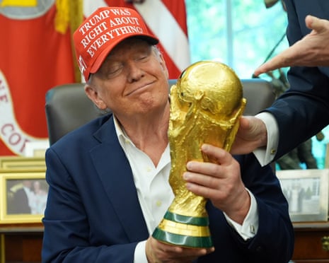 Donald Trump with the World Cup trophy in the Oval Office last year