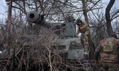 Ukrainian servicemen prepare to fire self-propelled howitzer, near the frontline town of Bakhmut.