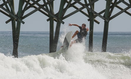 A surfer in Surf City, North Carolina in 2016.