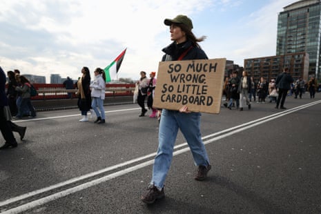 A demonstrator crosses Vauxhall Bridge during a pro-Palestinian protest in London on Saturday.