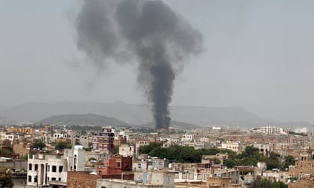Smoke rises from the damaged factory in Sana’a