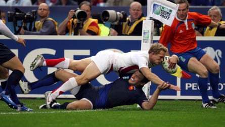 Josh Lewsey crashes over Damien Traille to score his try in Paris.