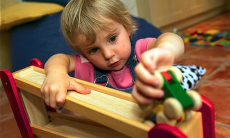 A child plays in a nursery.